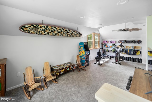 workout area featuring vaulted ceiling, carpet flooring, and baseboards