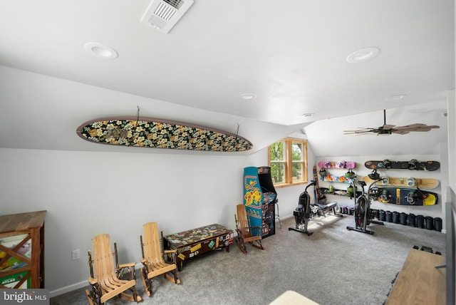 workout area featuring carpet and lofted ceiling