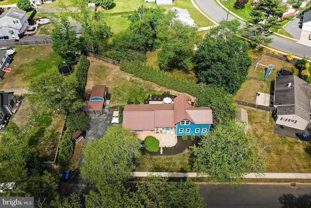 aerial view of property's location with nearby suburban area