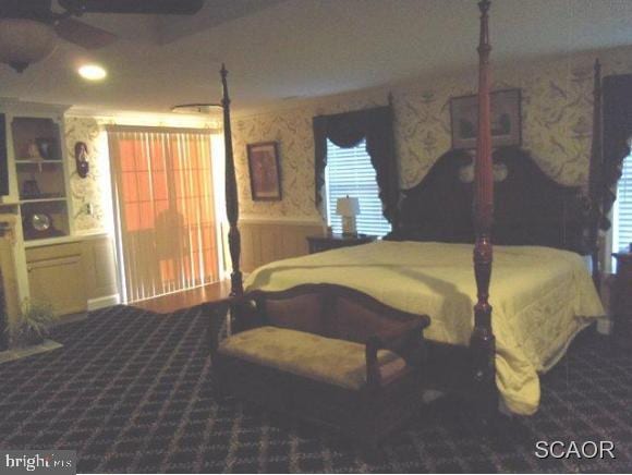 38802 Tyler Ave, Selbyville, DE 19975 - carpeted bedroom with wainscoting and wallpapered walls