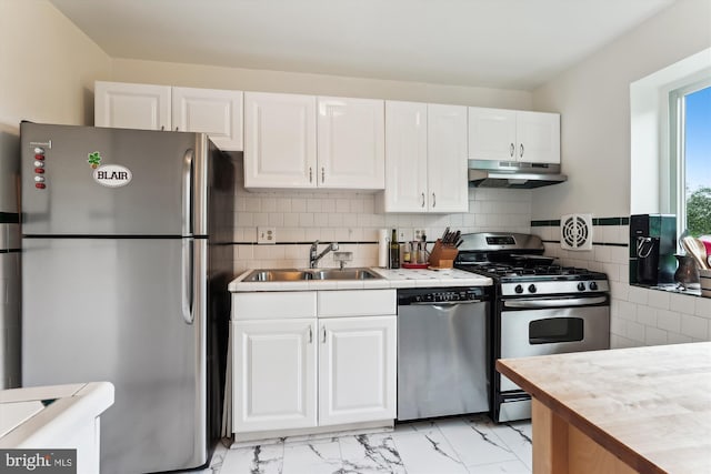 614 Sligo Ave Unit 504, Silver Spring, MD 20910 - kitchen with stainless steel appliances, a sink, under cabinet range hood, and white cabinets
