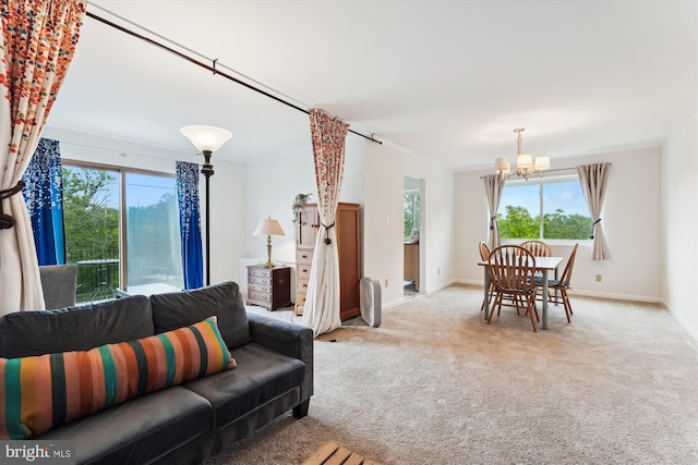 614 Sligo Ave Unit 504, Silver Spring, MD 20910 - carpeted living room with a chandelier, healthy amount of natural light, and baseboards