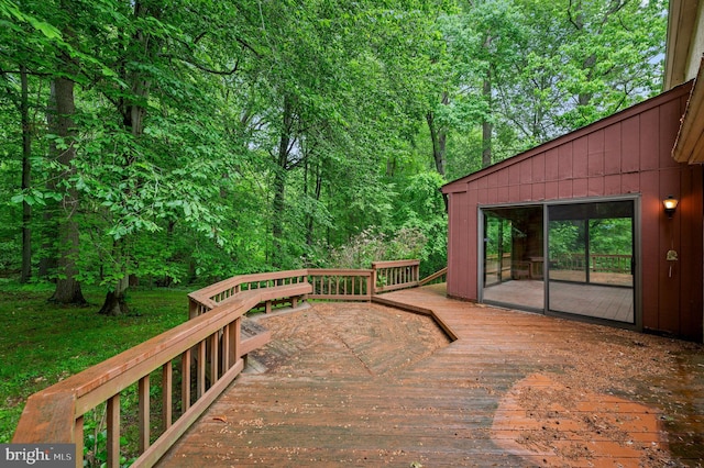 wooden terrace with a view of trees
