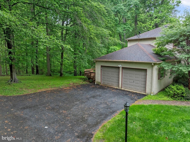 garage featuring a wooded view