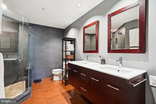 623 Main St Unit 623-B, Gaithersburg, MD 20878 - full bathroom featuring wood finished floors, tile walls, a stall shower, double vanity, and toilet