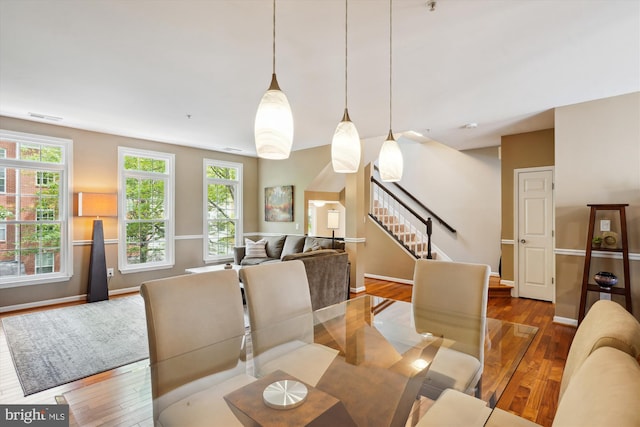623 Main St Unit 623-B, Gaithersburg, MD 20878 - dining area featuring wood finished floors, stairs, plenty of natural light, and baseboards