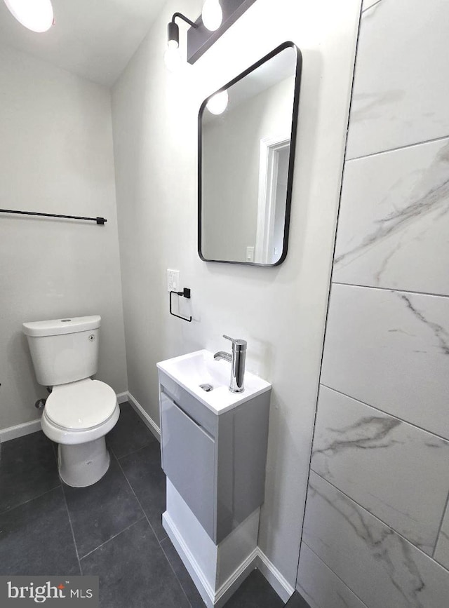 1937 Mayland St, Philadelphia, PA 19138 - half bathroom with toilet, vanity, tile patterned flooring, and baseboards