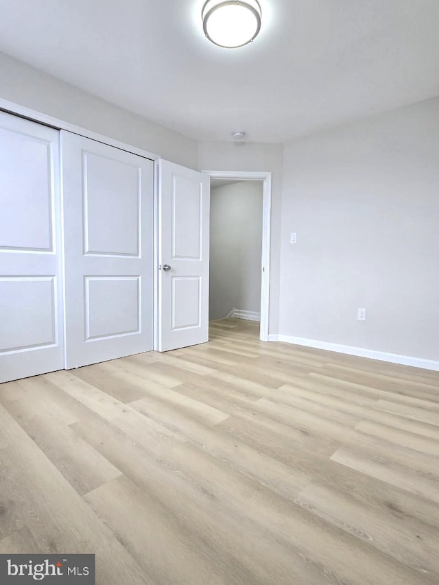 1937 Mayland St, Philadelphia, PA 19138 - unfurnished bedroom featuring light wood-type flooring, baseboards, and a closet