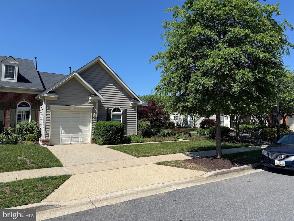 314 Colony Point Pl, Edgewater, MD 21037 - view of front of property featuring brick siding, an attached garage, and driveway