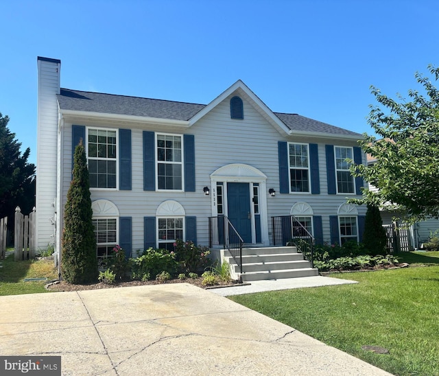 5533 Sponseller Ct, New Market, MD 21774 - bi-level home with a chimney and a front lawn
