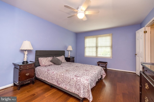 bedroom featuring dark wood-style floors, baseboards, and ceiling fan