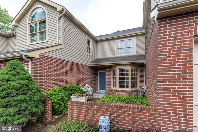 view of front of house featuring brick siding