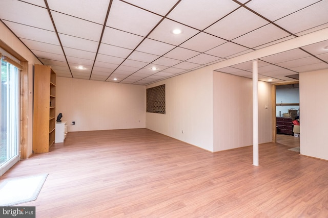 basement with light wood-style flooring and healthy amount of natural light