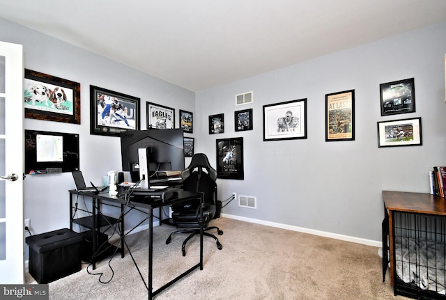office with carpet flooring and baseboards