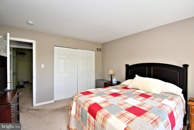 bedroom featuring carpet flooring, a closet, and baseboards