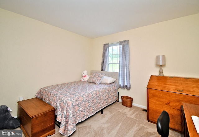 carpeted bedroom with baseboards