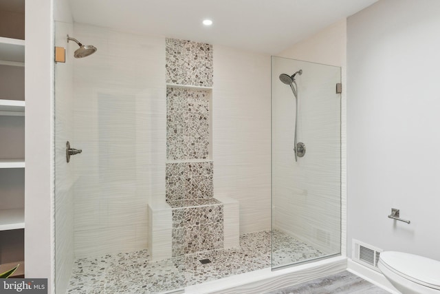 16110 Amethyst Ln, Bowie, MD 20716 - bathroom with a stall shower, toilet, and recessed lighting