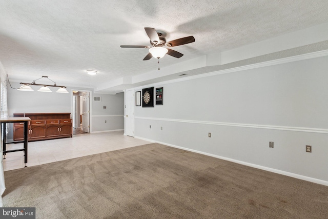 16110 Amethyst Ln, Bowie, MD 20716 - unfurnished living room featuring light colored carpet, ceiling fan, a textured ceiling, baseboards, and light tile patterned flooring