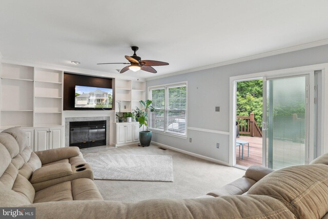 16110 Amethyst Ln, Bowie, MD 20716 - living room featuring crown molding, plenty of natural light, a ceiling fan, light carpet, and baseboards