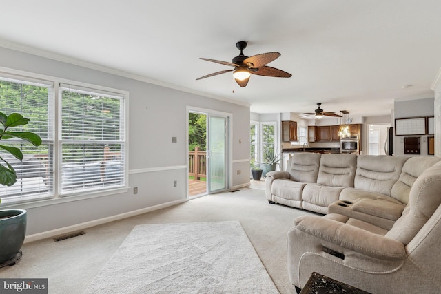 16110 Amethyst Ln, Bowie, MD 20716 - living area with ceiling fan, light colored carpet, crown molding, and baseboards