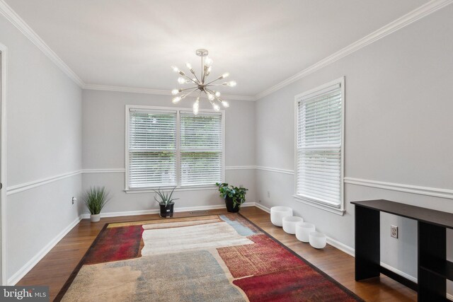 16110 Amethyst Ln, Bowie, MD 20716 - dining area featuring a chandelier, wood finished floors, ornamental molding, and baseboards