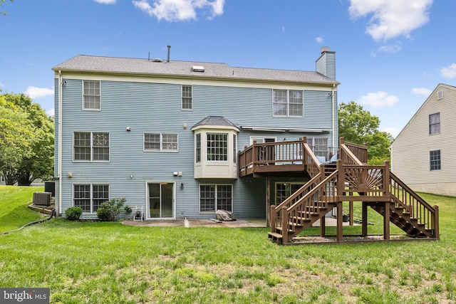 16110 Amethyst Ln, Bowie, MD 20716 - rear view of property with stairs, a chimney, a wooden deck, and a lawn