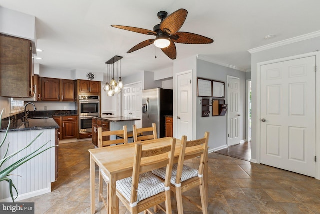16110 Amethyst Ln, Bowie, MD 20716 - dining area featuring a ceiling fan, baseboards, crown molding, dark stone finish floors, and a chandelier