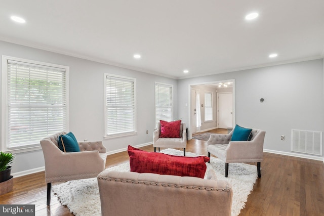 16110 Amethyst Ln, Bowie, MD 20716 - living area featuring ornamental molding, healthy amount of natural light, baseboards, wood finished floors, and recessed lighting