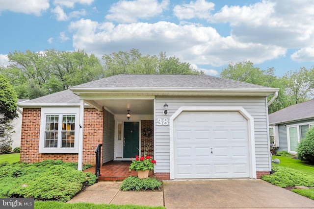 38 Falmouth Dr, Mount Laurel, NJ 08054 - ranch-style home featuring driveway, an attached garage, brick siding, a porch, and a shingled roof