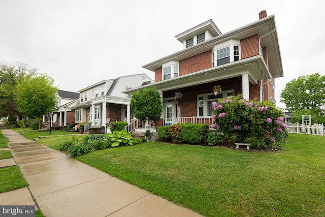 116 N Brobst St, Shillington, PA 19607 - traditional style home with brick siding, a porch, and a chimney