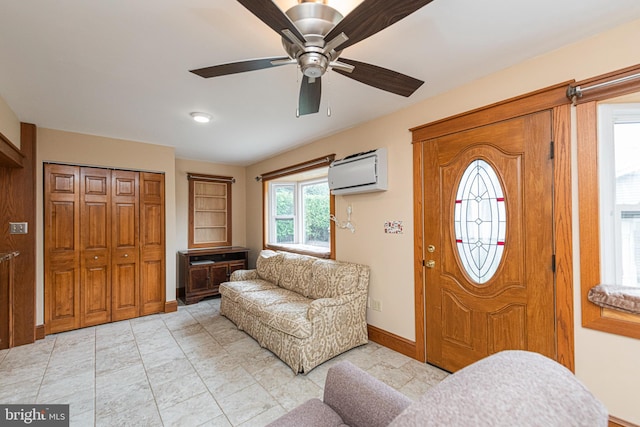 116 N Brobst St, Shillington, PA 19607 - foyer entrance with a wall mounted air conditioner, baseboards, and a ceiling fan