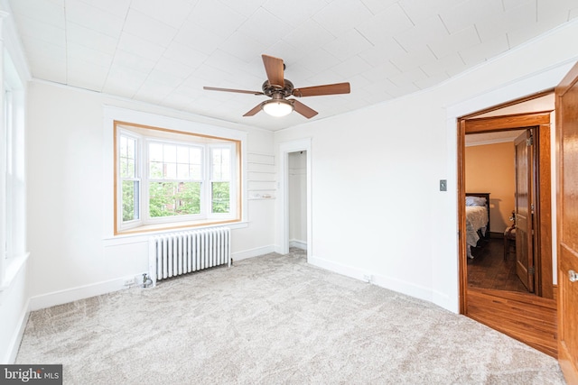 116 N Brobst St, Shillington, PA 19607 - unfurnished bedroom with radiator heating unit, carpet flooring, a closet, baseboards, and ornamental molding