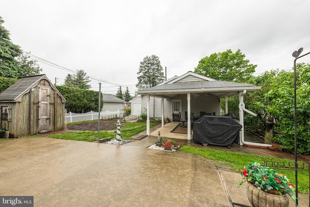 116 N Brobst St, Shillington, PA 19607 - view of patio with a storage unit, fence, and an outbuilding