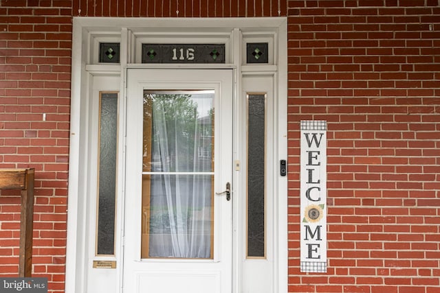 116 N Brobst St, Shillington, PA 19607 - property entrance featuring brick siding