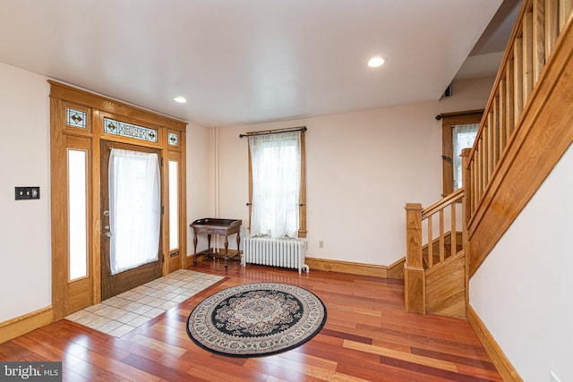 116 N Brobst St, Shillington, PA 19607 - entryway with radiator, wood-type flooring, stairway, baseboards, and recessed lighting