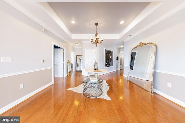 12800 Libertys Delight Dr Unit 403, Bowie, MD 20720 - living area with a raised ceiling, a chandelier, light wood-style flooring, baseboards, and crown molding