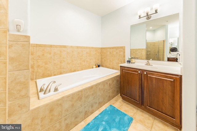 12800 Libertys Delight Dr Unit 403, Bowie, MD 20720 - full bathroom with tile patterned flooring, a shower stall, vanity, and a garden tub