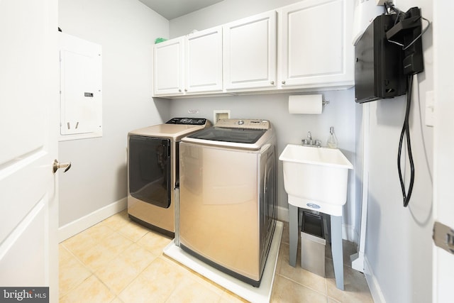12800 Libertys Delight Dr Unit 403, Bowie, MD 20720 - washroom with cabinet space, electric panel, washer and dryer, baseboards, and light tile patterned flooring