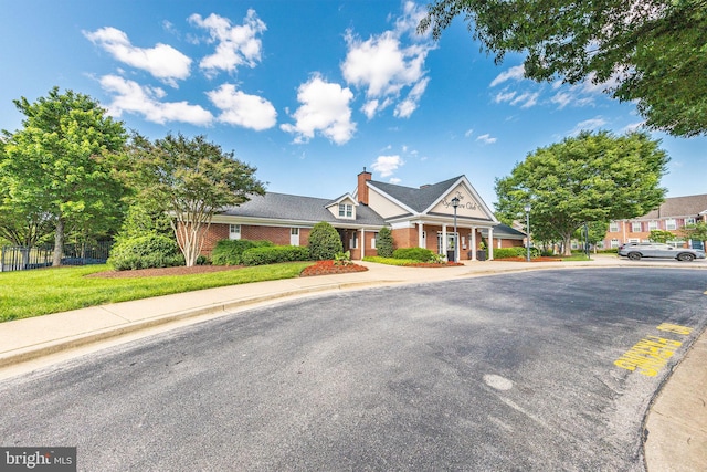 12800 Libertys Delight Dr Unit 403, Bowie, MD 20720 - greek revival inspired property featuring brick siding, a chimney, and a porch