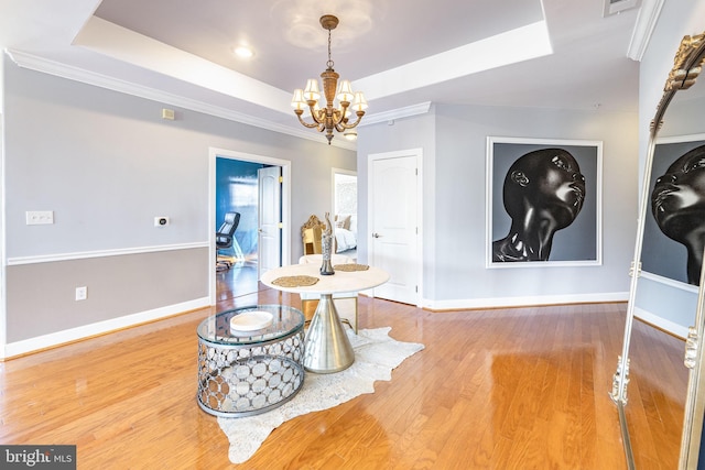 12800 Libertys Delight Dr Unit 403, Bowie, MD 20720 - dining space with a raised ceiling, a chandelier, baseboards, wood finished floors, and crown molding