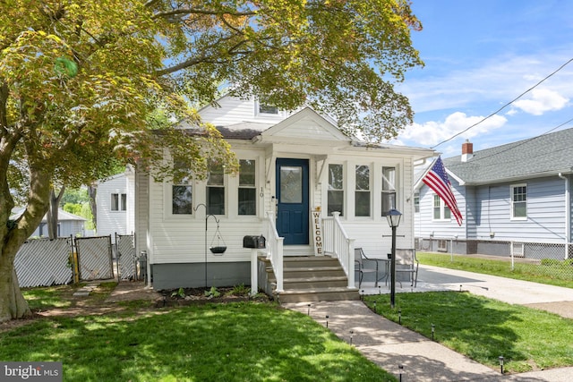 view of front of house with a gate