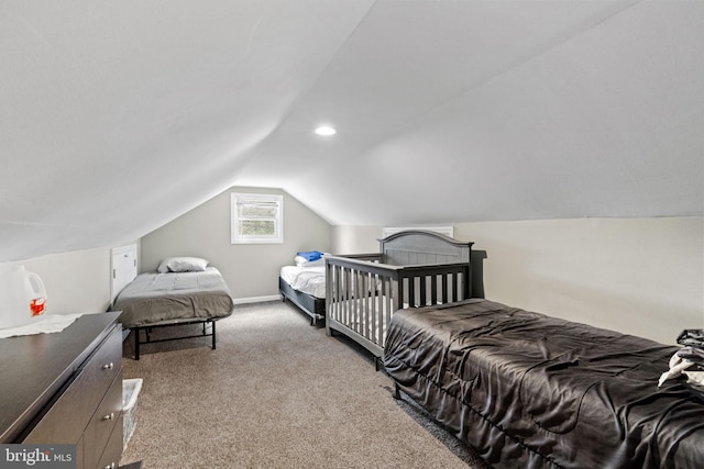 bedroom with lofted ceiling, carpet flooring, and baseboards