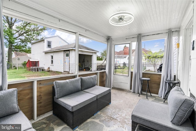 sunroom / solarium with an outdoor hangout area