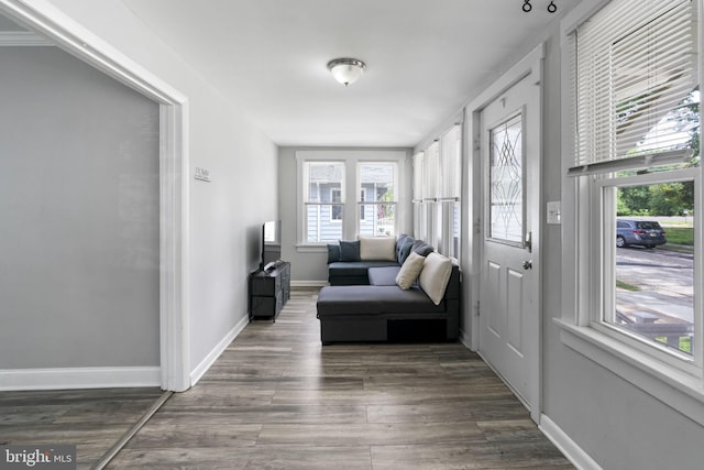 sunroom / solarium featuring healthy amount of natural light