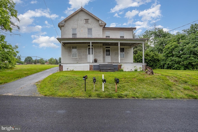 320 E Front St, Lewisberry, PA 17339 - view of front facade with a porch and a front lawn