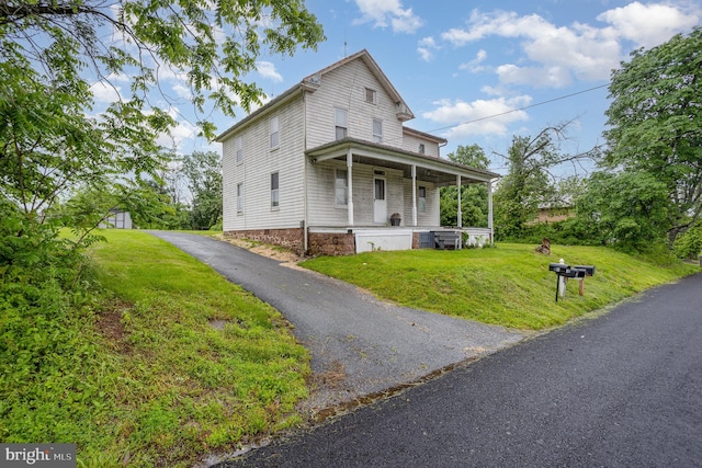 320 E Front St, Lewisberry, PA 17339 - view of front facade with covered porch and a front yard