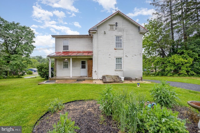 320 E Front St, Lewisberry, PA 17339 - back of property with a lawn, metal roof, and a standing seam roof