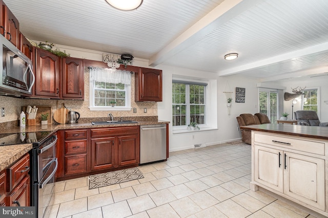1070 George Brown Rd, Millerstown, PA 17062 - kitchen with appliances with stainless steel finishes, a sink, backsplash, beam ceiling, and light tile patterned floors