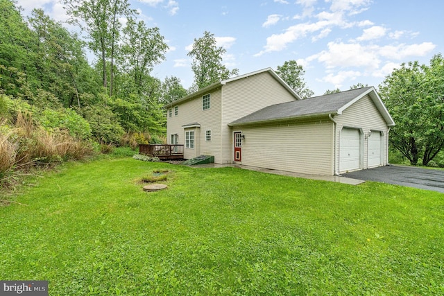 1070 George Brown Rd, Millerstown, PA 17062 - rear view of house with a wooden deck, a yard, and a garage
