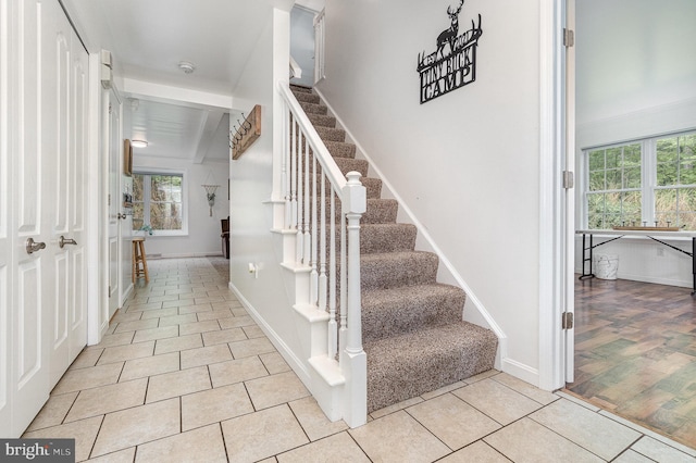 1070 George Brown Rd, Millerstown, PA 17062 - stairway with healthy amount of natural light, tile patterned flooring, and baseboards